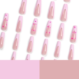 Pink French press-on nails with long ballerina shape and heart star patterns