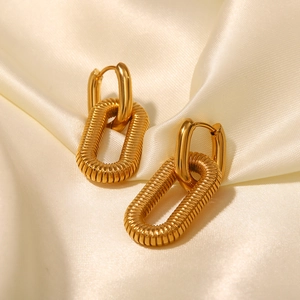 Detail view of 18K gold plated stainless steel earrings with textured spiral design