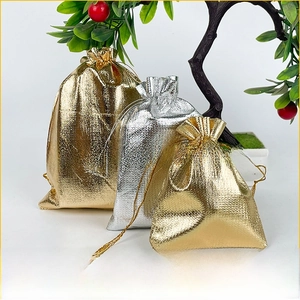 Metallic gold and silver drawstring jewelry pouches in small, medium, and large sizes