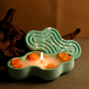 Cloud-shaped green silicone mold storage box with white marble texture and floral candle