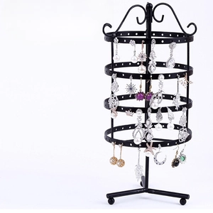 Rotating four-tier black metal earring display stand with ornamental top and stable base