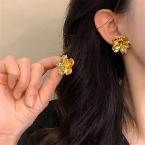 Chic 3D golden metal flower stud earrings with a glossy finish for stylish women