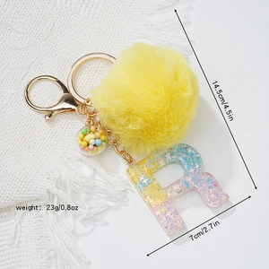 Star resin letter R keychain detail with size chart, yellow pompom and golden keyring