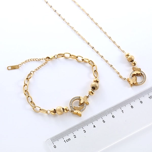 Elegant gold stainless steel butterfly necklace and bracelet set with cubic zirconia stones