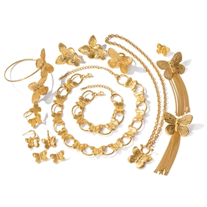 Vintage gold butterfly jewelry set including necklaces, bracelets, earrings, and rings