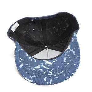 Detail view of cotton hip hop cap interior with tie-dye print and adjustable strap