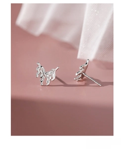 Macro shot of S999 sterling silver lava butterfly stud earrings with textured finish