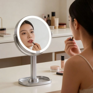 Modern LED desktop makeup mirror with round smart light and storage base for vanity use