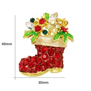 Christmas stocking brooch in gold alloy with red rhinestones and 40mm x 30mm dimensions