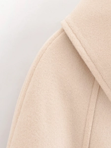 Close-up of double-stitched collar detail on beige wool blend casual jacket for women