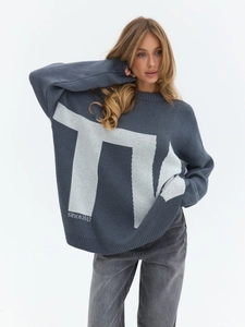 Oversized grey knit sweater featuring white letter jacquard pattern and a casual crew neck