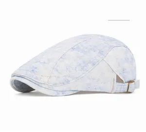 Close-up of vintage blue washed denim flat cap with adjustable metal side buckle