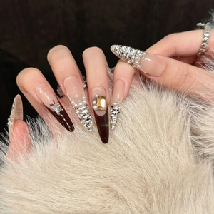 Red French tweed press-on nails with pearls and amber gemstone on luxury white fur