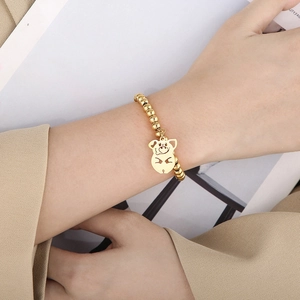18K gold plated stainless steel bead bracelet with a cute hollowed-out pig pendant