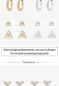 Detailed view of clover stud earrings with gold PVD plating and clear zircon crystals