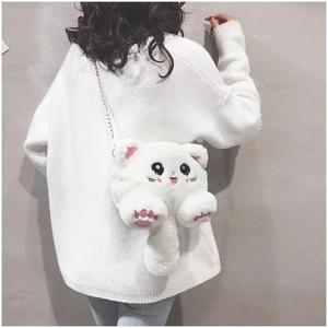 Detail of cute white plush cat crossbody bag featuring pink paw embroidery and gold chain