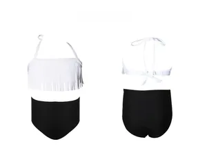Front and back detail of girls' white tassel halter bikini with black high waist swim shorts