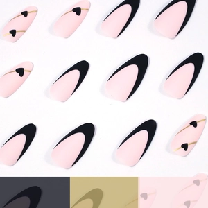 French tip almond press-on nails with black outlines and pink heart design accents