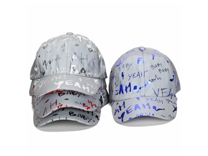 Close-up of hip hop baseball caps with reflective fabric and colorful graffiti letters