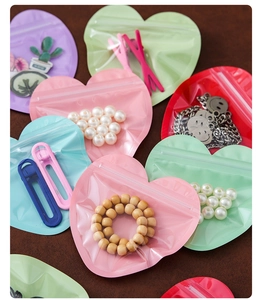 Macro view of colorful heart-shaped self-sealing bags for jewelry and candy packaging