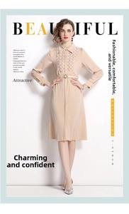 Detail of the beige long-sleeved shirt dress with a thin belt and woven collar texture