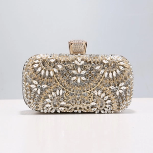 Close-up of sparkling floral rhinestone patterns and luxury crystal clasp on evening bag