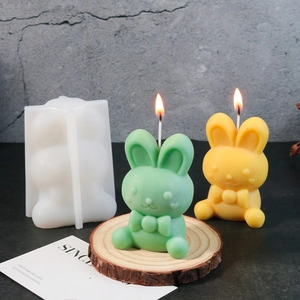 Detailed view of translucent silicone Easter bunny mold with a bow-knot candle result