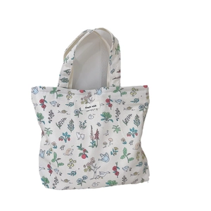 Cream canvas tote bag with colorful hand-drawn floral and animal prints for daily use