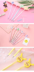 Detailed view of creative gel pens featuring sequins, glitter sand, and cartoon animal tops