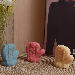 Detailed macro view showing realistic knitted texture on winter glove silicone molds