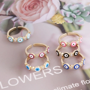 Set of 6 gold adjustable evil eye rings with colorful enamel and cubic zirconia accents