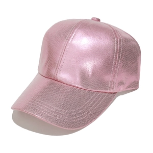 Detail view of pink metallic PU leather baseball cap with a shiny finish and curved brim