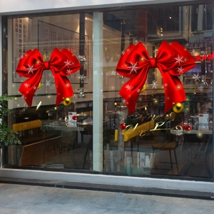 Christmas window decals featuring red bows, golden ornaments, and Merry Christmas text