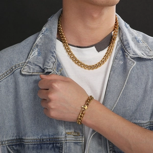 Men's 11mm gold-plated curb chain necklace and bracelet set shown on model