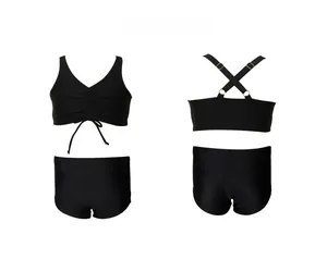 Front and back detail of black two-piece kids swimsuit with adjustable cross straps