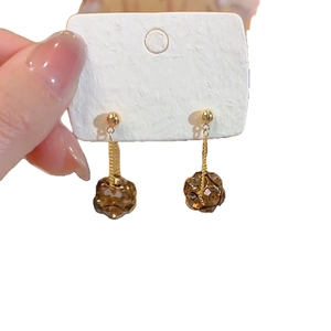 Elegant gold chain earrings with brown faceted beads on a clean white background