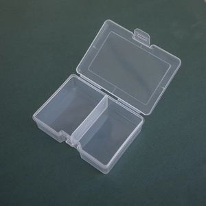 Close-up of a 2-compartment transparent plastic storage box with secure lid closure