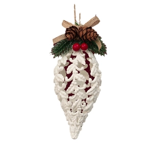 White hollow Christmas tree ornament with pine cones, red berries and a burlap bow