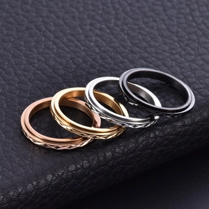 Rotatable stainless steel rings with diamond pattern in gold, silver, black, and rose gold