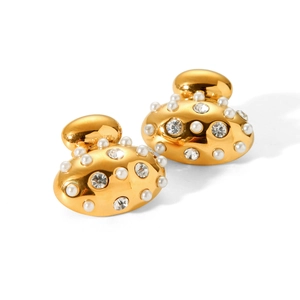 Detail of gold titanium steel earrings with white pearls and sparkling crystal stones