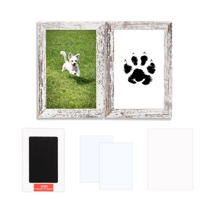 Detail of wooden pet paw print memorial kit with double frame and clean-touch ink pad