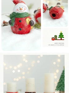 Detail of Christmas snowman ceramic candle holder with Becker classic white pillar candles