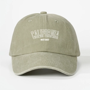 Detail of California West Coast embroidery on vintage washed olive green cotton baseball cap