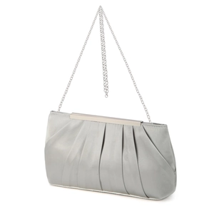 Detailed view of silver satin pleated evening clutch bag with elegant metal chain strap