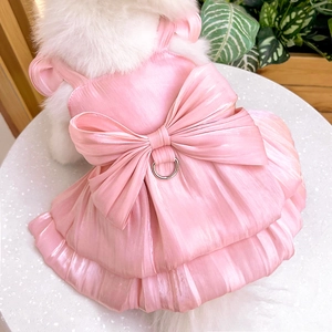 Detail of pink satin pet wedding dress with large bow and metal D-ring for leash