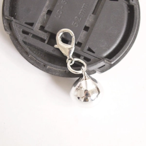 Polished silver metal round bell pendant with lobster clasp for bags and accessories