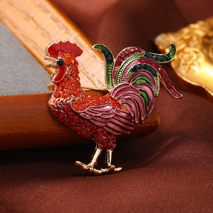 Vintage rooster brooch with colorful enamel and sparkling rhinestones on golden base