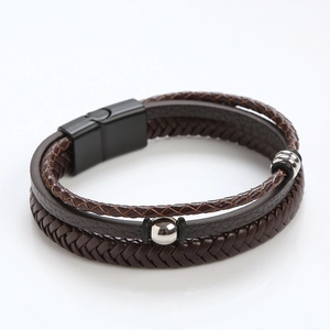 Detail of multi-layer woven leather bracelet with magnetic clasp and silver beads