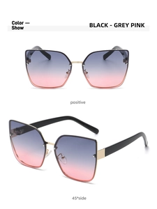 Detail view of cat eye sunglasses showing black frames and grey pink gradient lenses
