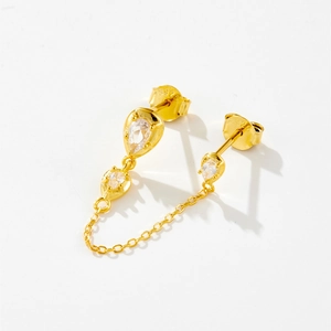 Detail shot of gold-plated S925 silver stud earring with chain and teardrop gems